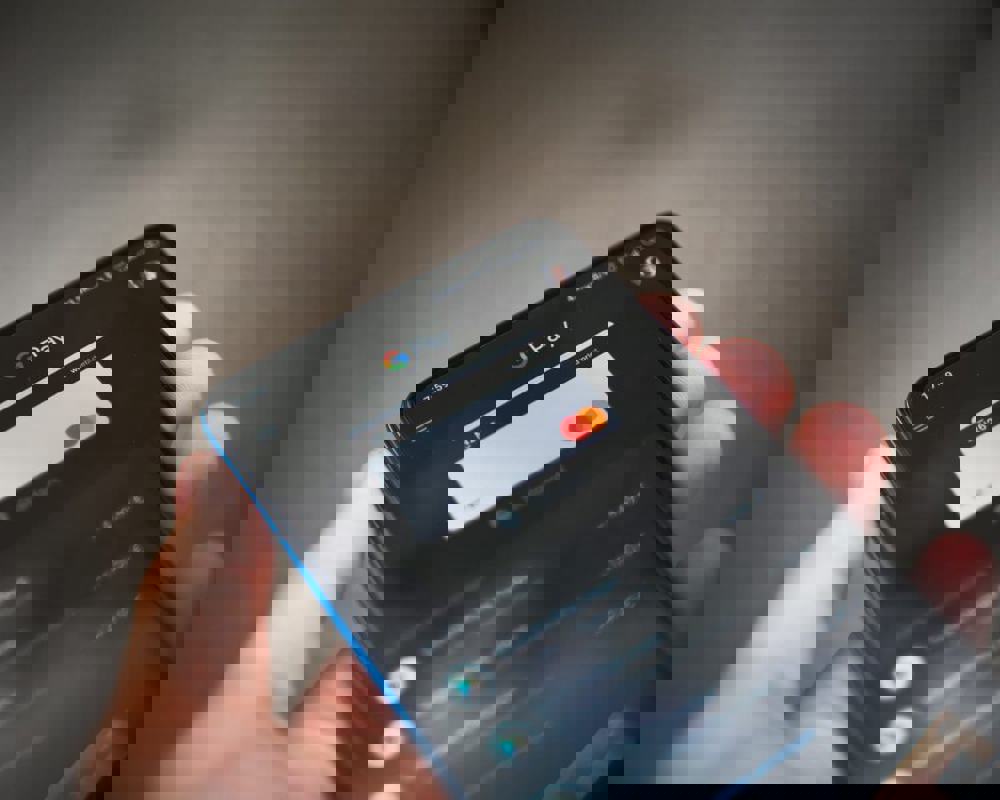 Person holding mobile phone